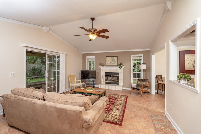 living room with ceiling fan, lofted ceiling, and ornamental molding