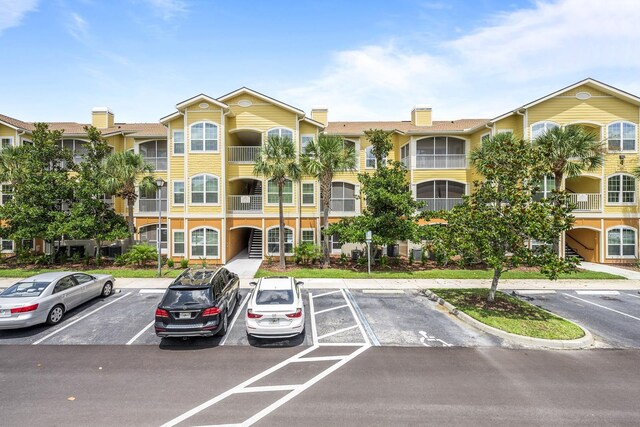 225 Old Village Center Cir Unit 4308, Saint Augustine, FL 32084 - view of building exterior with uncovered parking