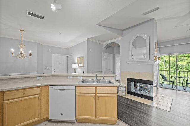 225 Old Village Center Cir Unit 4308, Saint Augustine, FL 32084 - kitchen with dishwasher, a chandelier, a tiled fireplace, light countertops, and pendant lighting