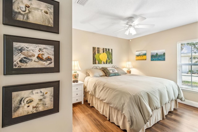 303 S Ocean Trace Rd, Saint Augustine, FL 32080 - bedroom with wood finished floors and a ceiling fan