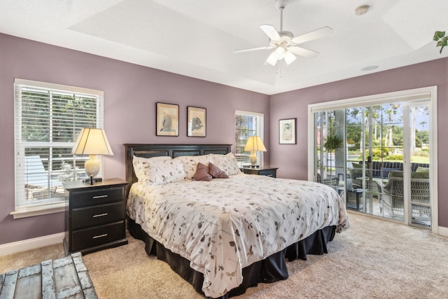 303 S Ocean Trace Rd, Saint Augustine, FL 32080 - bedroom with access to outside, light colored carpet, baseboards, and a raised ceiling