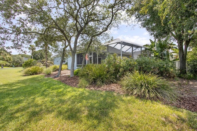 303 S Ocean Trace Rd, Saint Augustine, FL 32080 - view of green lawn with glass enclosure