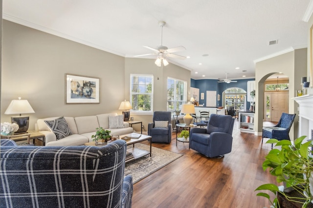 303 S Ocean Trace Rd, Saint Augustine, FL 32080 - living room featuring ceiling fan, wood finished floors, arched walkways, crown molding, and recessed lighting