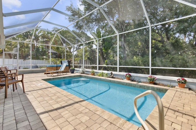 303 S Ocean Trace Rd, Saint Augustine, FL 32080 - view of swimming pool featuring a patio area, a fenced backyard, glass enclosure, and a hot tub