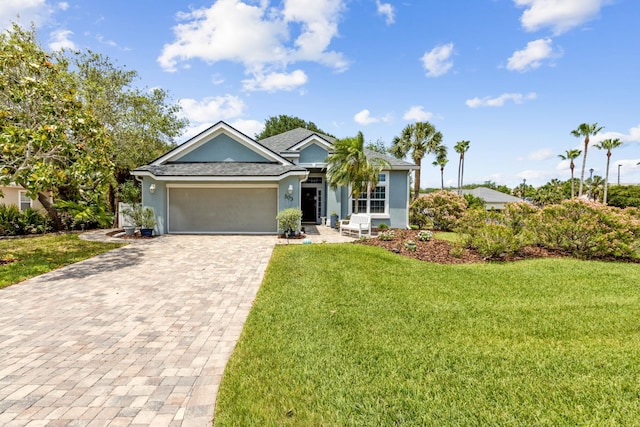303 S Ocean Trace Rd, Saint Augustine, FL 32080 - single story home featuring decorative driveway, stucco siding, a garage, and a front yard