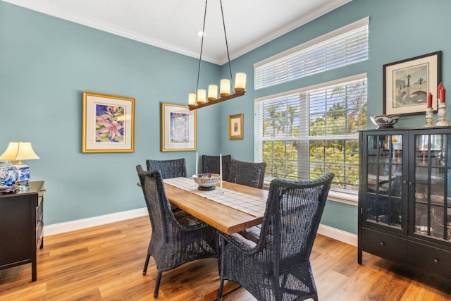 303 S Ocean Trace Rd, Saint Augustine, FL 32080 - dining area with crown molding, baseboards, and wood finished floors