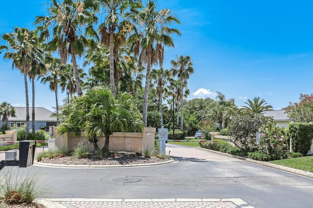 303 S Ocean Trace Rd, Saint Augustine, FL 32080 - view of asphalt street featuring curbs and a gated entry