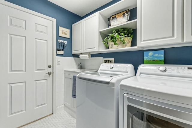 303 S Ocean Trace Rd, Saint Augustine, FL 32080 - clothes washing area with cabinet space and independent washer and dryer