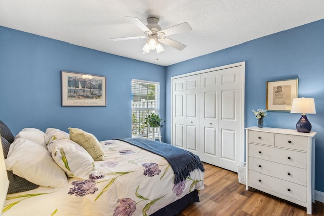 303 S Ocean Trace Rd, Saint Augustine, FL 32080 - bedroom with a closet, wood finished floors, ceiling fan, and a textured ceiling