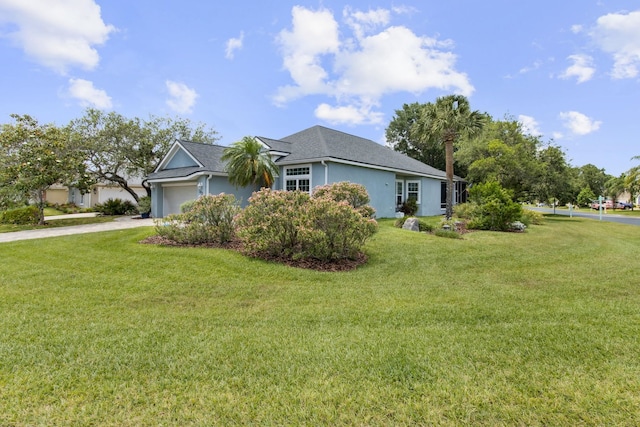 303 S Ocean Trace Rd, Saint Augustine, FL 32080 - view of front of home featuring an attached garage, stucco siding, a front lawn, concrete driveway, and roof with shingles