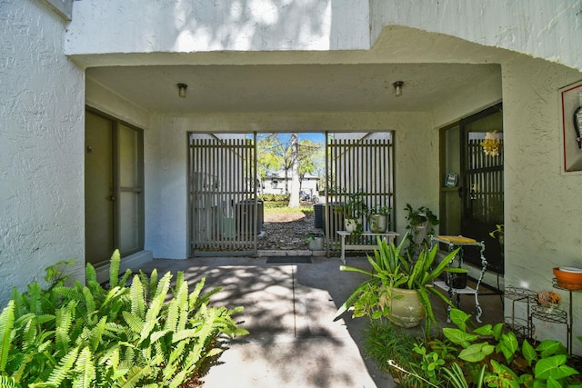 3 Tarragona Ct, Saint Augustine, FL 32086 - entrance to property with a patio area and stucco siding
