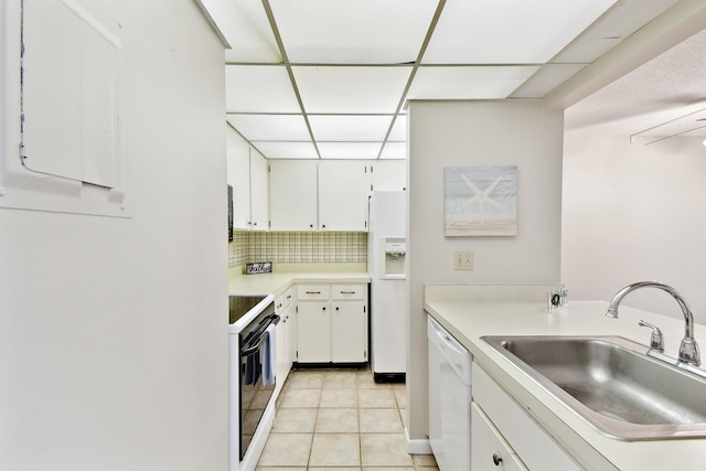 3 Tarragona Ct, Saint Augustine, FL 32086 - kitchen with white appliances, a sink, light countertops, white cabinetry, and a drop ceiling