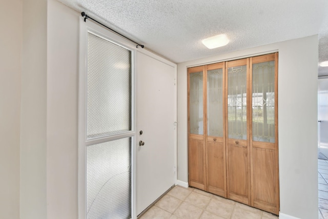 3 Tarragona Ct, Saint Augustine, FL 32086 - foyer entrance featuring a textured ceiling and light tile patterned flooring