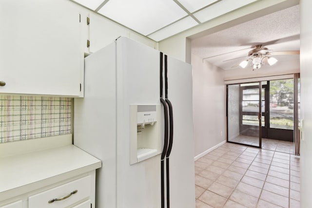 3 Tarragona Ct, Saint Augustine, FL 32086 - kitchen featuring white refrigerator with ice dispenser, light countertops, a ceiling fan, white cabinetry, and a textured ceiling