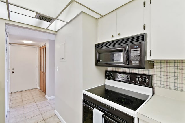 3 Tarragona Ct, Saint Augustine, FL 32086 - kitchen featuring electric range oven, black microwave, white cabinetry, and light countertops