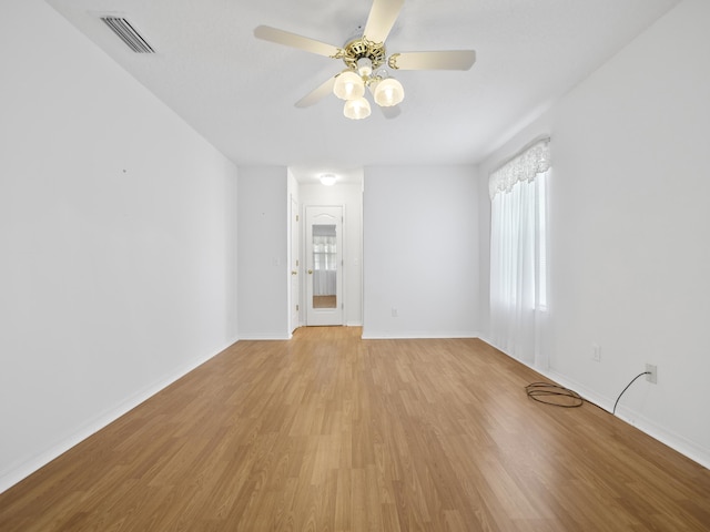 spare room with ceiling fan and light hardwood / wood-style floors