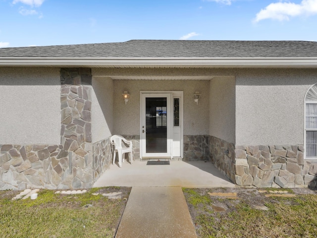 doorway to property with a patio area