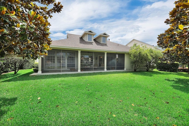 159 La Mesa Dr, Saint Augustine, FL 32095 - rear view of house with a sunroom, a lawn, and a shingled roof