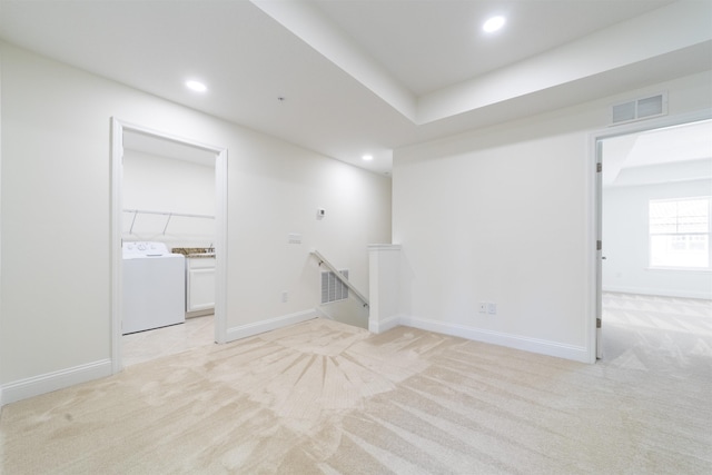 interior space with washer / dryer and light carpet