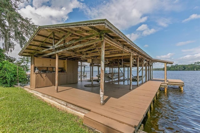 view of dock featuring boat lift and a water view