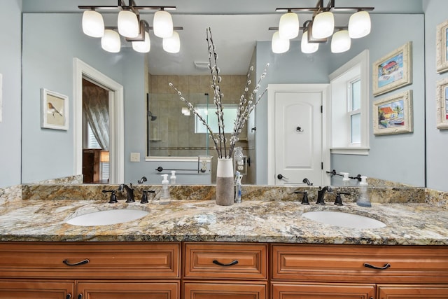 137 Twine St, Saint Augustine, FL 32084 - bathroom featuring double vanity, a stall shower, a notable chandelier, and a sink