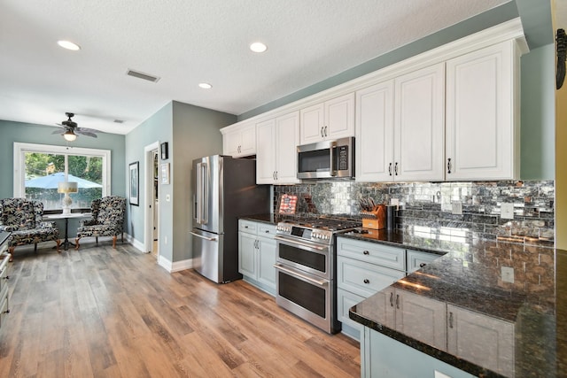137 Twine St, Saint Augustine, FL 32084 - kitchen featuring stainless steel appliances, visible vents, a ceiling fan, tasteful backsplash, and white cabinetry