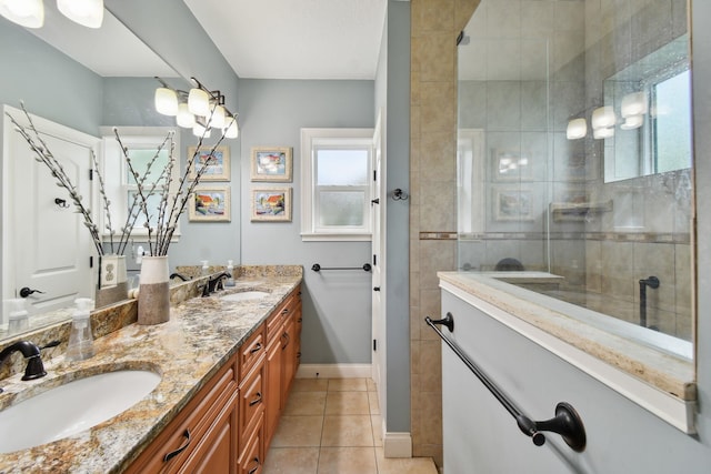 137 Twine St, Saint Augustine, FL 32084 - bathroom with a tile shower, double vanity, tile patterned flooring, and a sink