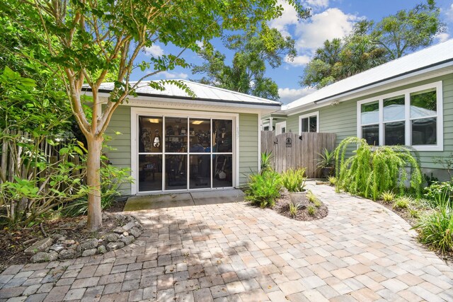 rear view of property featuring a patio