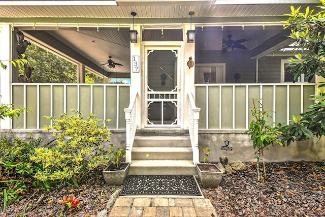 property entrance with a porch and ceiling fan