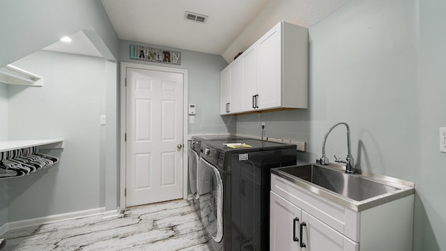 700 N Indigo Ter, Saint Johns, FL 32259 - washroom with washer and dryer, cabinet space, light wood-style flooring, and baseboards