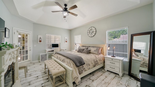 700 N Indigo Ter, Saint Johns, FL 32259 - bedroom featuring baseboards, a ceiling fan, and a fireplace