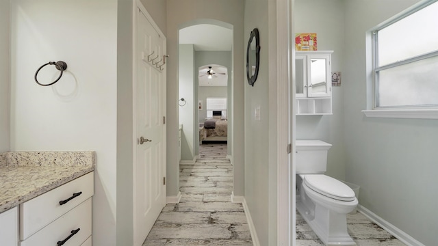 700 N Indigo Ter, Saint Johns, FL 32259 - ensuite bathroom with vanity, toilet, baseboards, and a ceiling fan