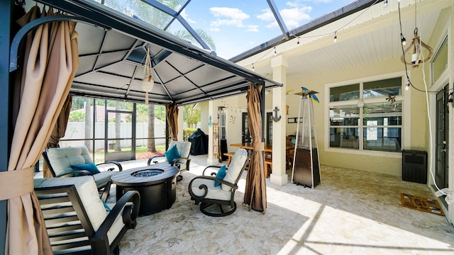 700 N Indigo Ter, Saint Johns, FL 32259 - view of patio featuring a fire pit, a gazebo, and a lanai