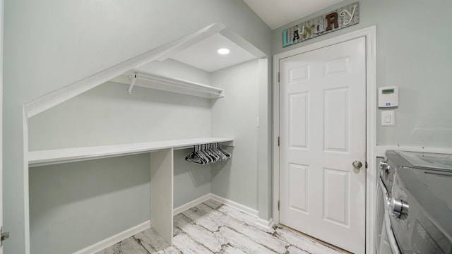 700 N Indigo Ter, Saint Johns, FL 32259 - walk in closet featuring washing machine and clothes dryer and light wood-type flooring