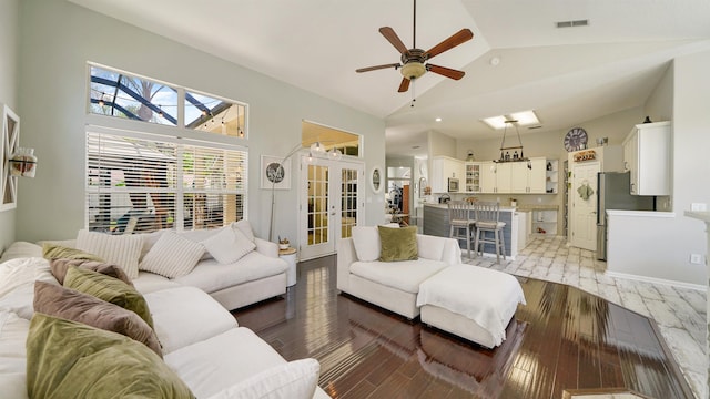 700 N Indigo Ter, Saint Johns, FL 32259 - living area featuring light wood finished floors, ceiling fan, french doors, and high vaulted ceiling