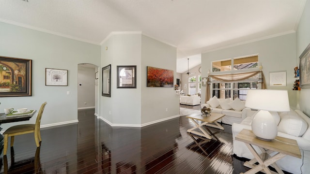 700 N Indigo Ter, Saint Johns, FL 32259 - living area featuring arched walkways, baseboards, wood finished floors, and crown molding