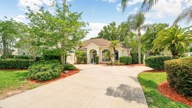 700 N Indigo Ter, Saint Johns, FL 32259 - mediterranean / spanish-style house featuring driveway and stucco siding