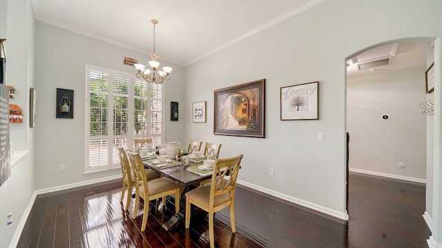 700 N Indigo Ter, Saint Johns, FL 32259 - dining space with dark wood-type flooring, crown molding, baseboards, arched walkways, and a chandelier