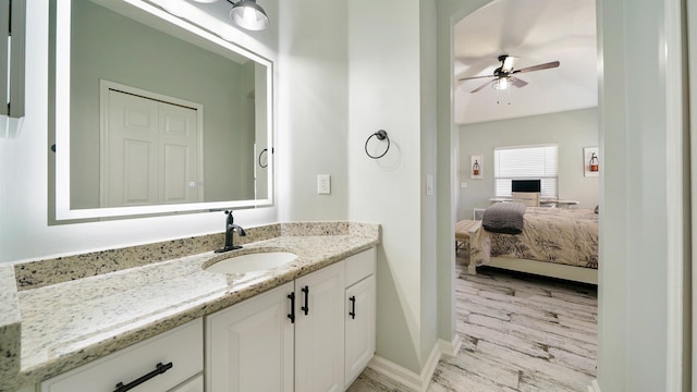 700 N Indigo Ter, Saint Johns, FL 32259 - ensuite bathroom featuring vanity, a ceiling fan, wood finished floors, and baseboards