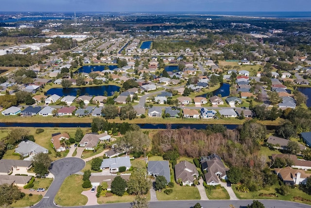 aerial view featuring a water view and a residential view