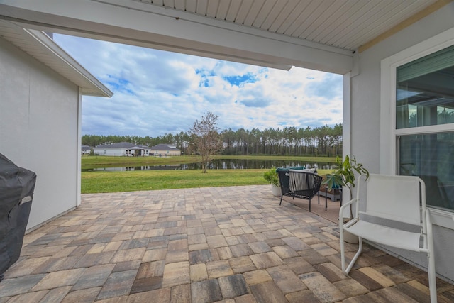 view of patio / terrace featuring a water view