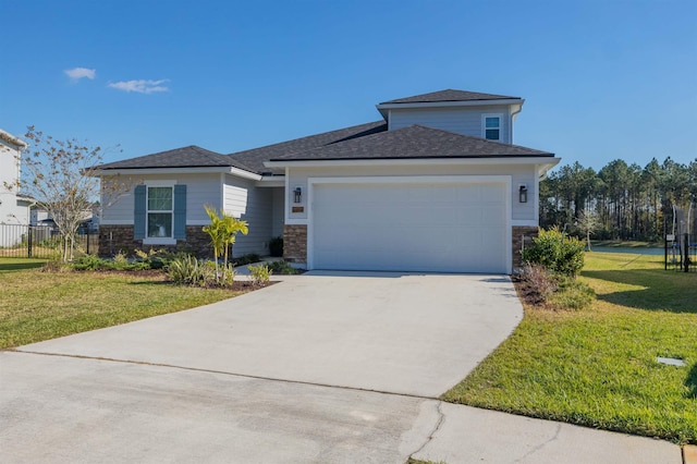 view of front of house featuring a garage and a front yard