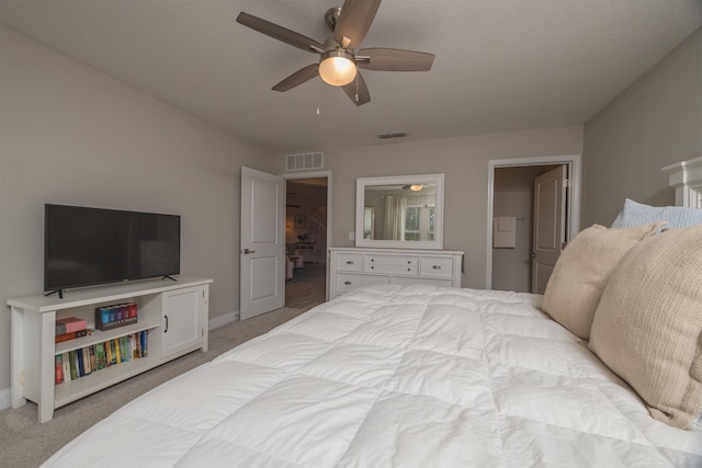 bedroom featuring light colored carpet and ceiling fan