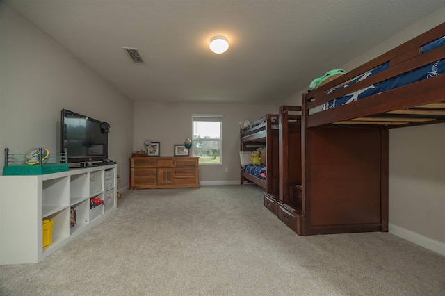 bedroom featuring light carpet