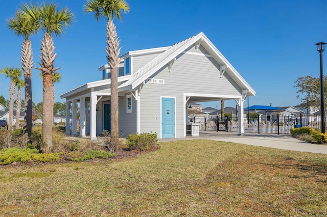 view of front facade featuring a carport and a front yard