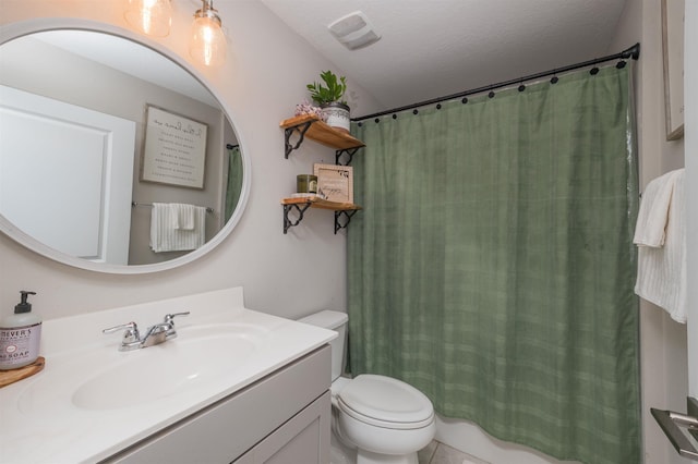 bathroom with vanity, toilet, a textured ceiling, and a shower with shower curtain