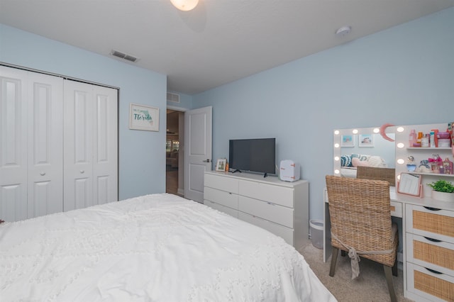 carpeted bedroom with a closet