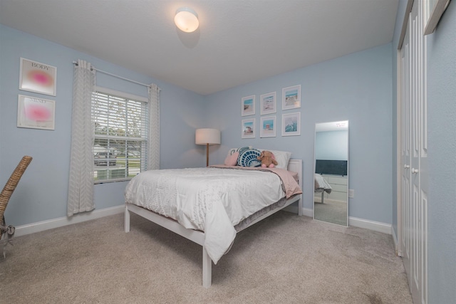 bedroom featuring light colored carpet