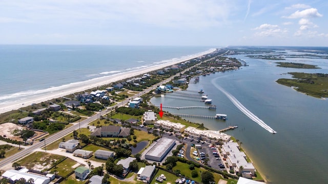 drone / aerial view with a water view and a view of the beach