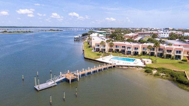 birds eye view of property with a water view